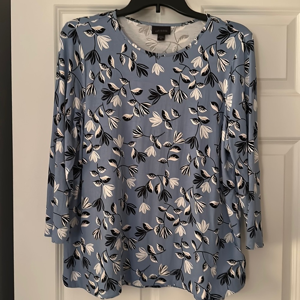Gray blue blouse with white and black leaves. In excellent condition.